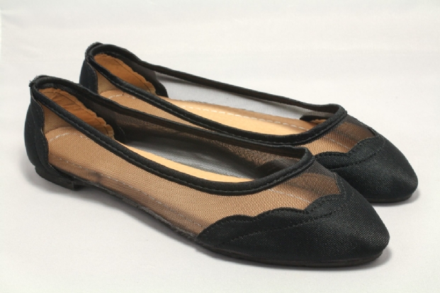 Black fabric and mesh inset flats.