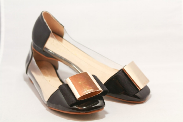 Black patent flats with transparent inset and Gold buckle.