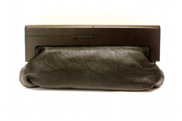 Clutch bag in Black faux leather with wooden handle.