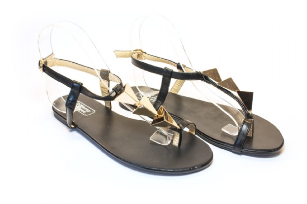 Black with gold triangle toe-ring T-bar sandals.